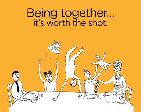 Being together - it's worth a shot. A group of people sit together around a table enjoying each other's company 
